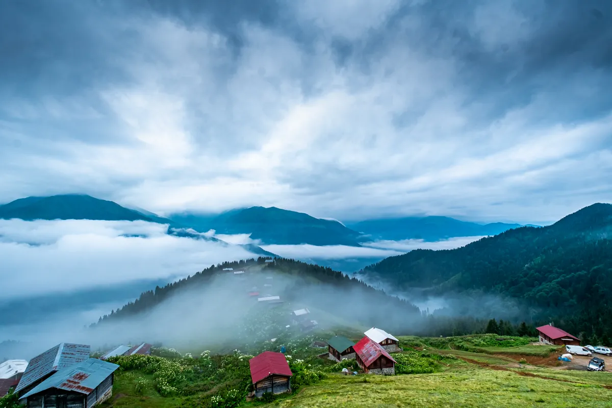 Highland houses above a sea of clouds at Pokut